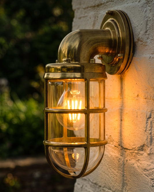 'Whitby' Antique Brass Bulkhead Outdoor Wall Light Digital Illustration At Night