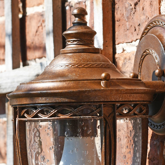 Close up of bronze finish ornate detail on wall mounted lantern