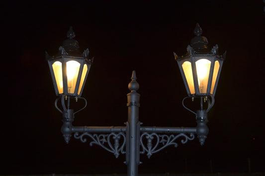 Hexagonal double headed lamp post at night