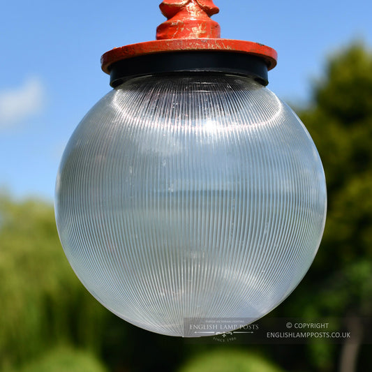 Opaque Globe Luminaire On Antique Red Lamp Post