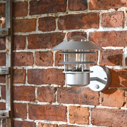 Modern Silver Wall Light On Brick Wall