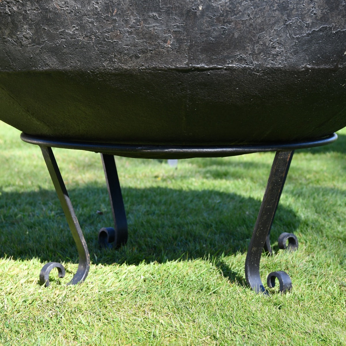 Close up of scroll feet stand on Kadai Fire Bowl 