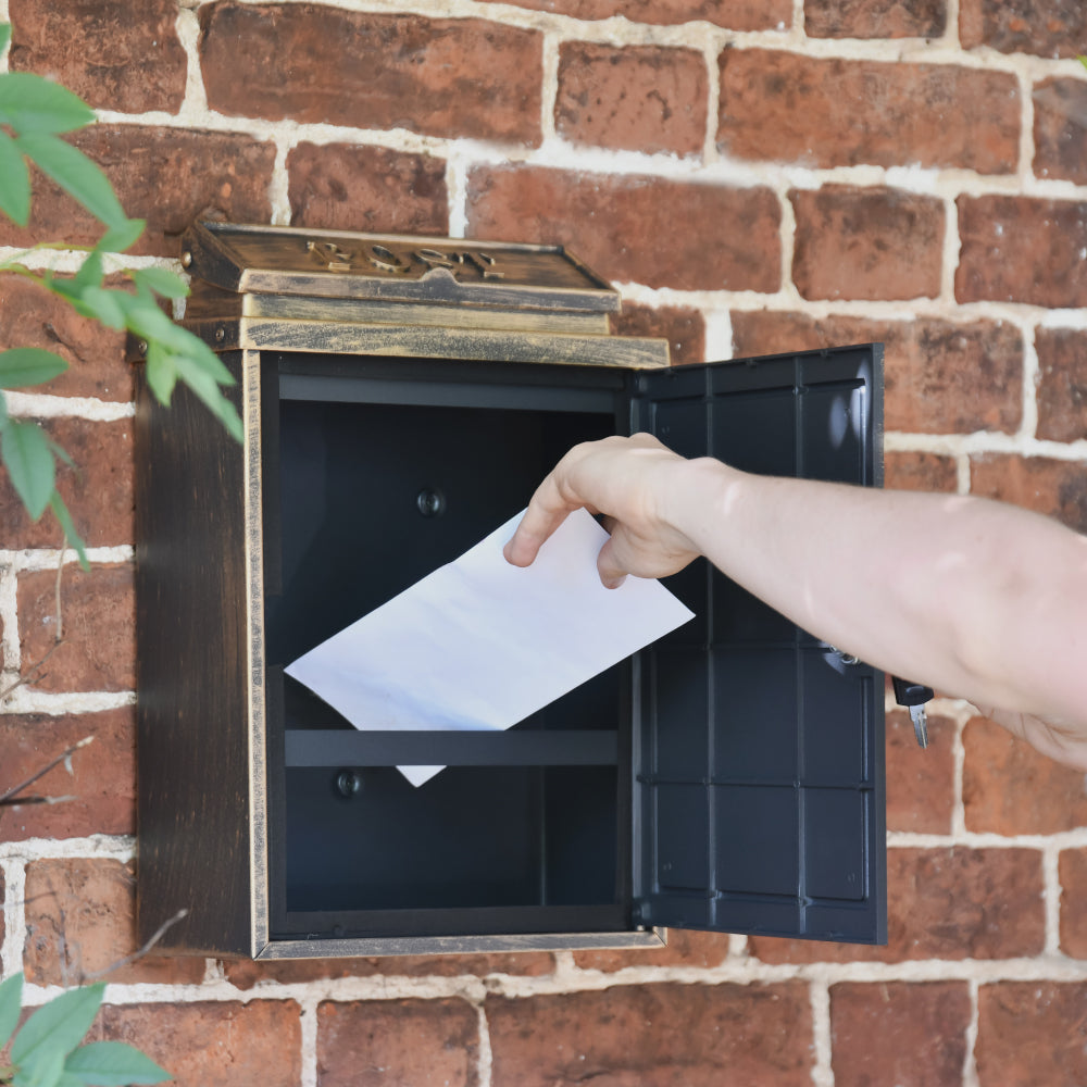 View of post being retrieved from the post box