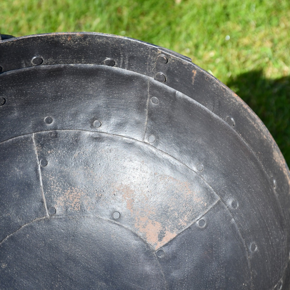 Close up of rivetted design on fire bowl 