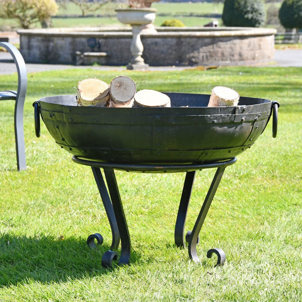 70cm Kadai Fire Bowl with stand in garden setting 