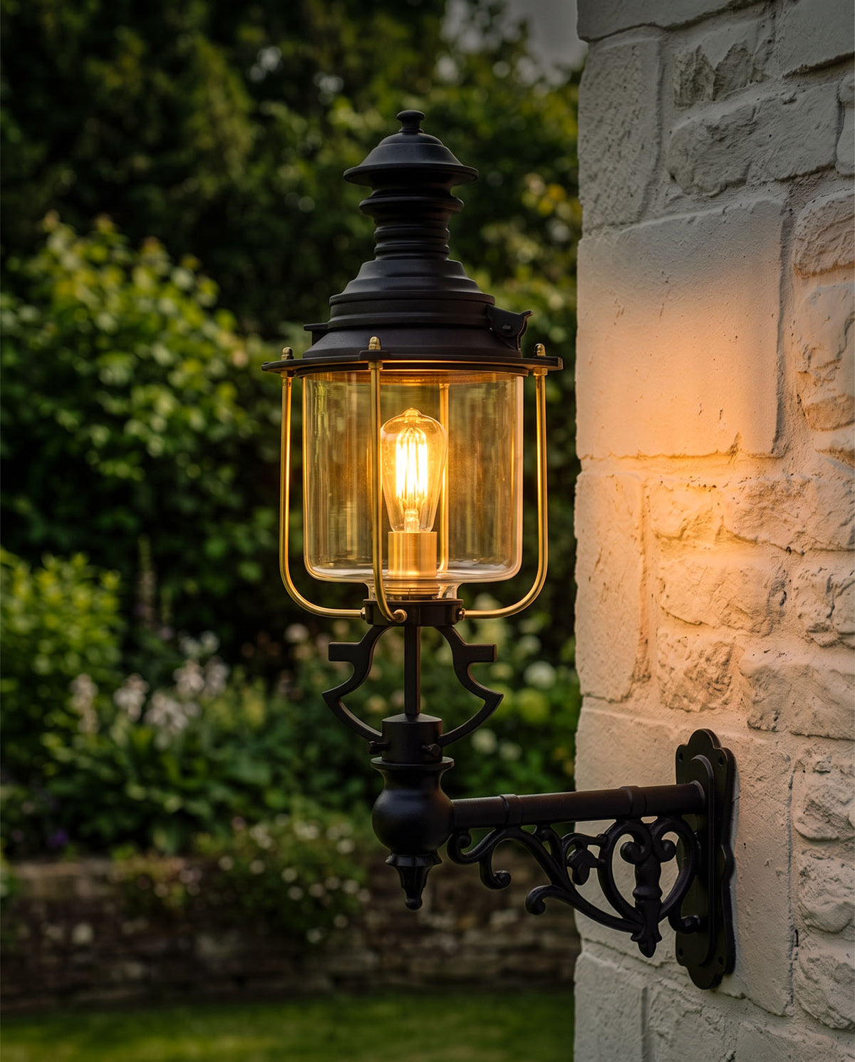 Small Belgravia Glass Garden Wall Light At Night