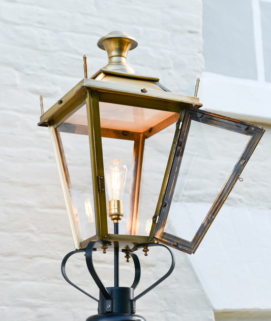 The antique brass lantern with the door open