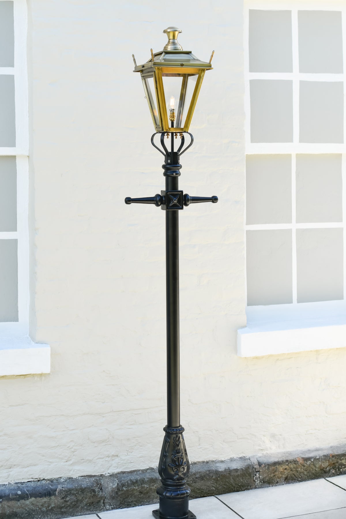 The Antique brass Dorchester lantern on black garden lamp post
