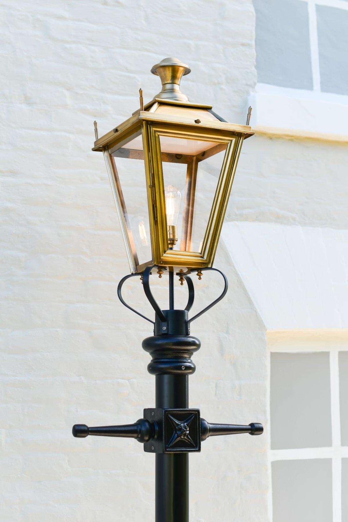 The antique brass lantern and black ladder bars