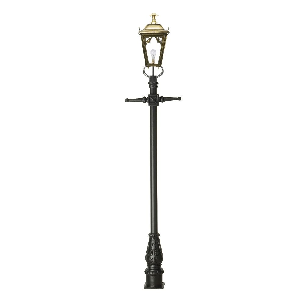 The antique brass lamp post on a white background
