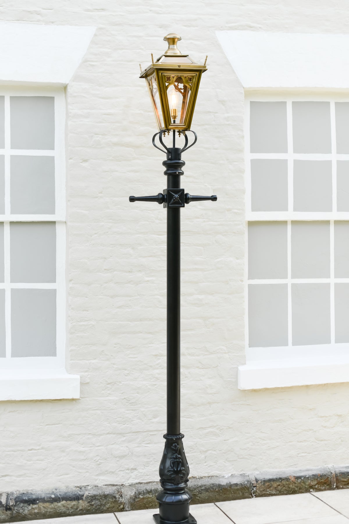 The antique brass lamp post 