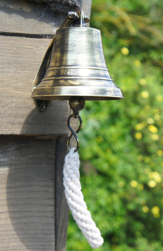 Antique Brass Ships Bell on Wall Outside
