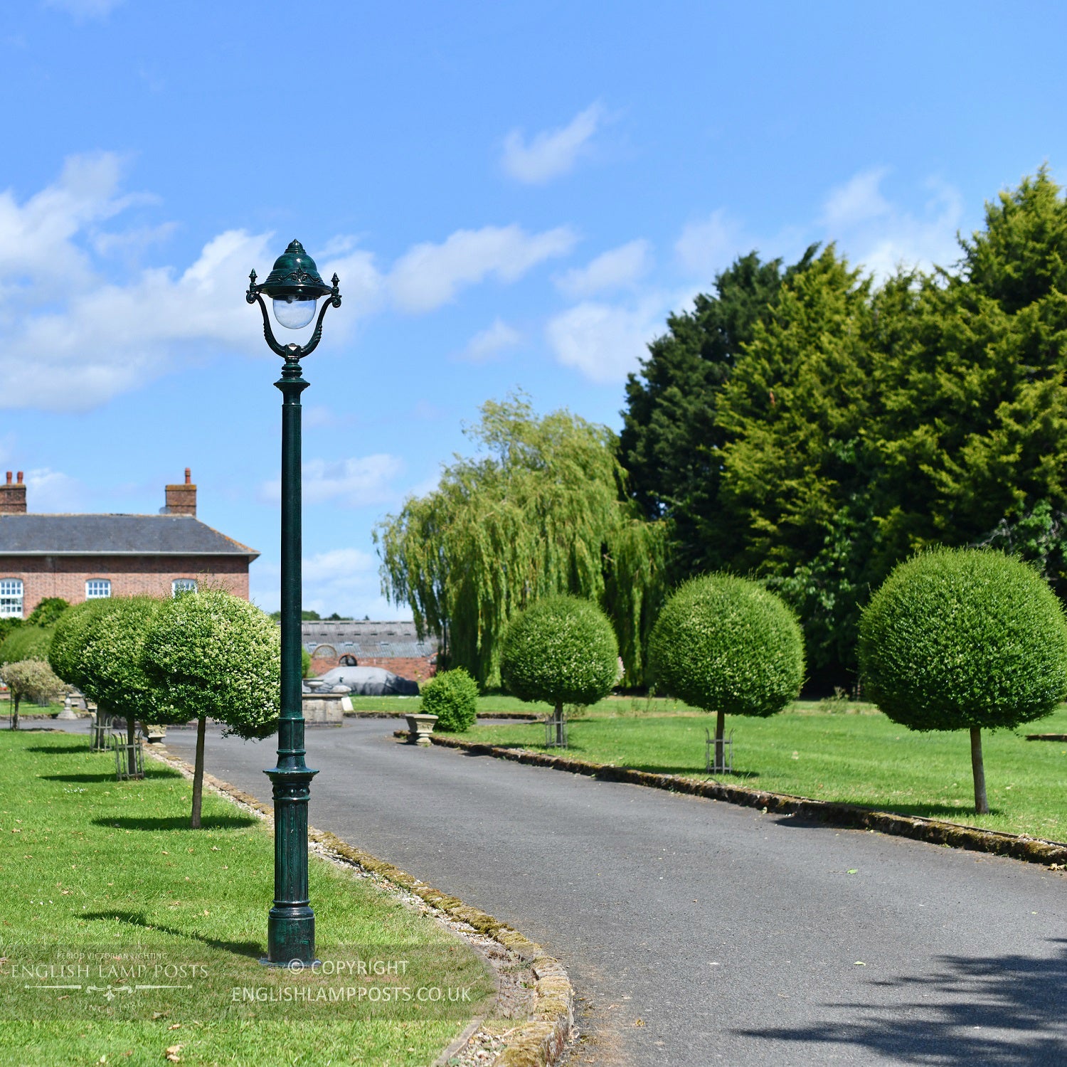 Antique Green Garden Lamp Post In Garden Setting