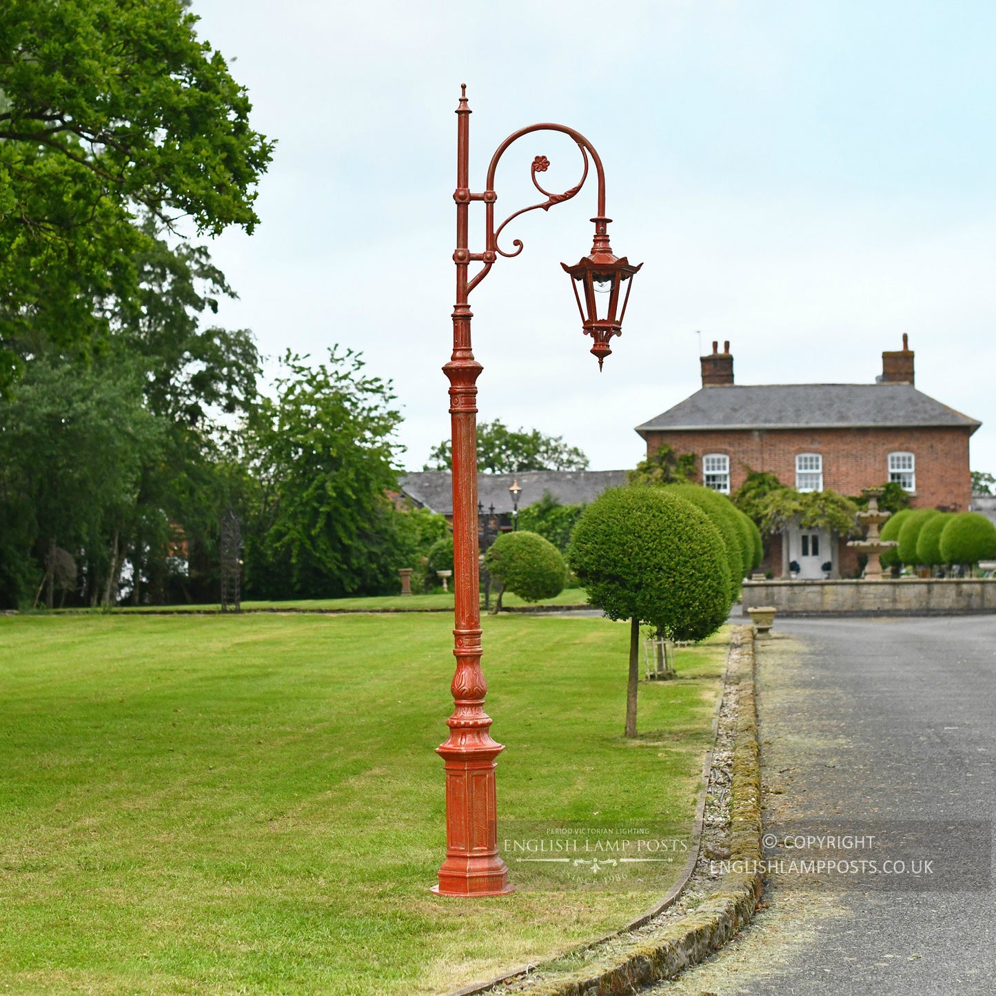 Antique Red Cast Iron Lamp Post Column Installed On Driveway