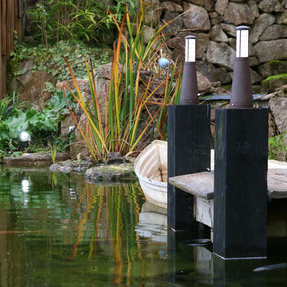 The aged iron bollards on pillars