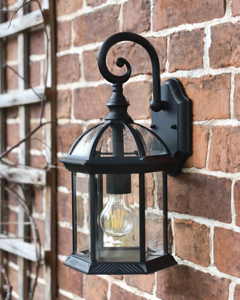 Angled view of the bird caged inspired wall light 
