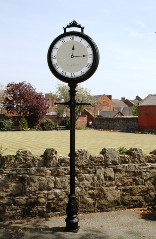 Bespoke lamp post clock in front of field