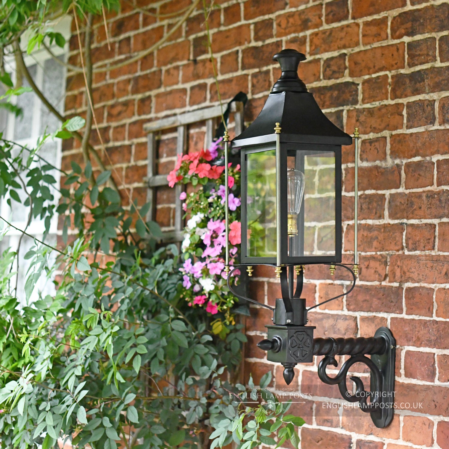 Black and Brass Rochford Victorian Garden Wall Light Installed On Brick Wall