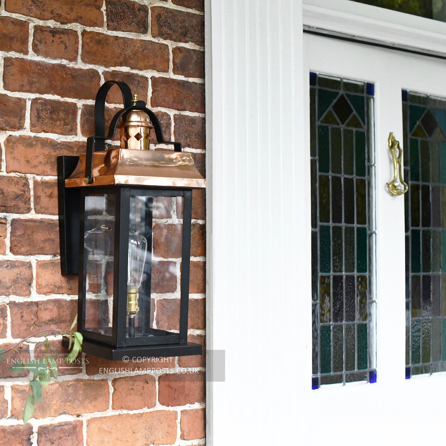 Black and Copper Wall Light Installed In Period Porch Way
