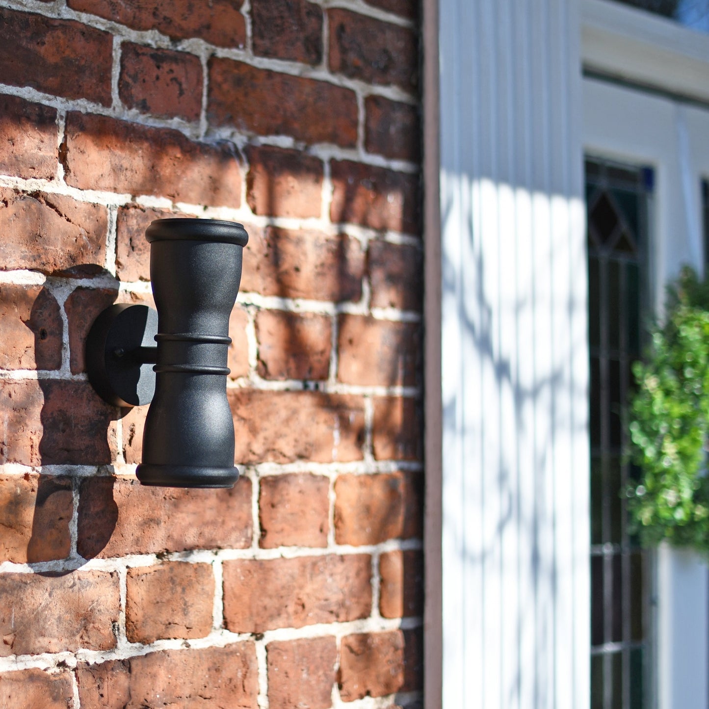 Black Contemporary Up and Down Light On Brick Wall
