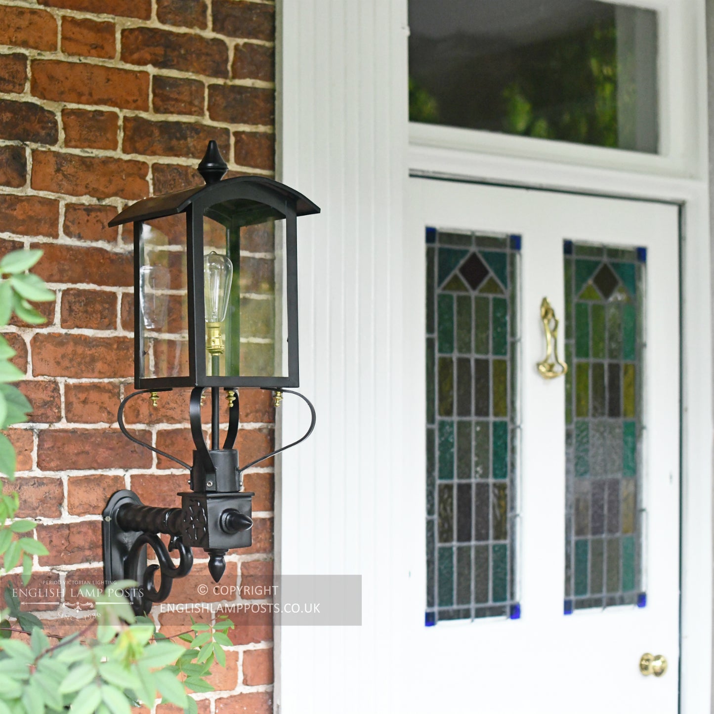 Black Curved Top Victorian Garden Wall Light Installed By Front Door