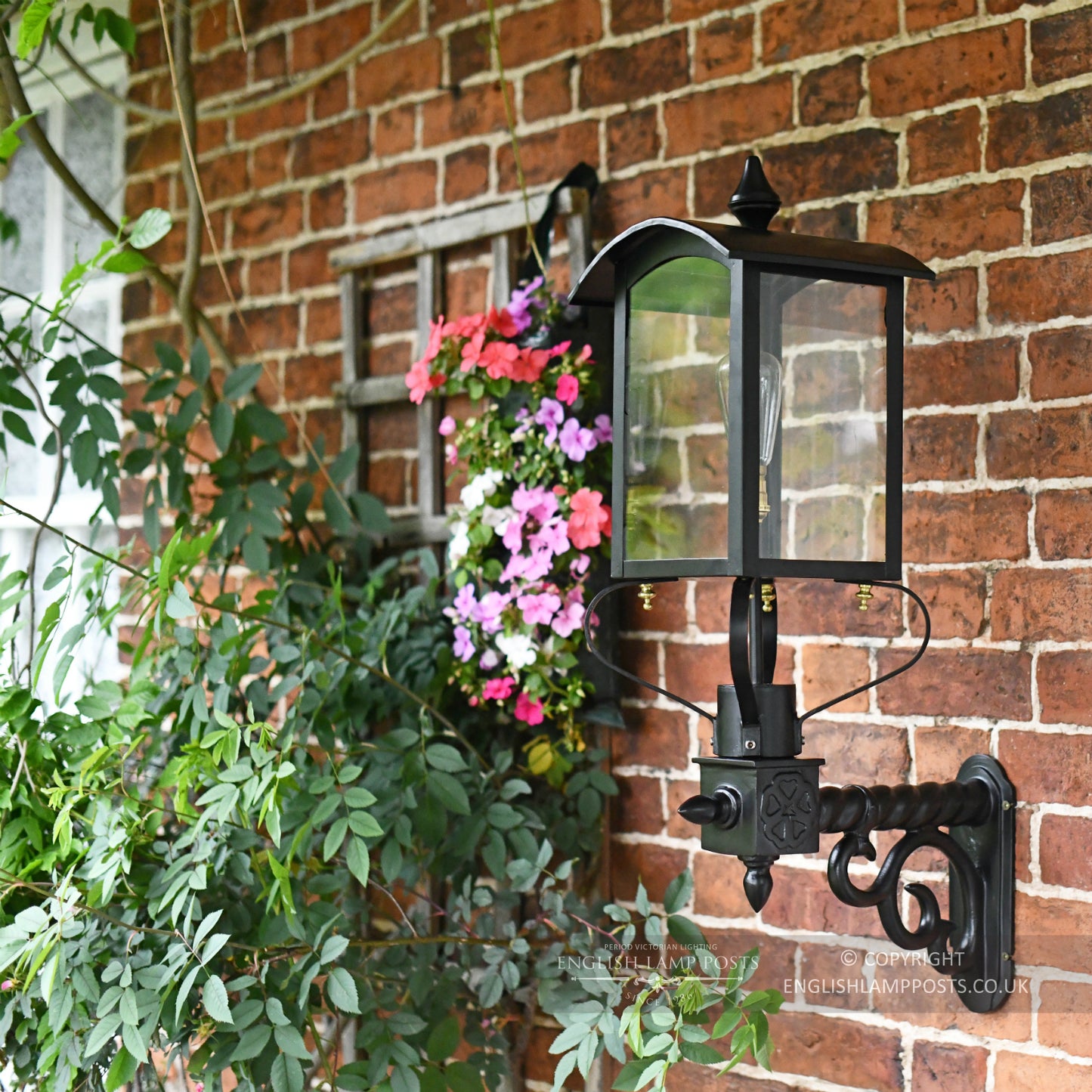 Black Curved Top Victorian Garden Wall Light On Brick Wall