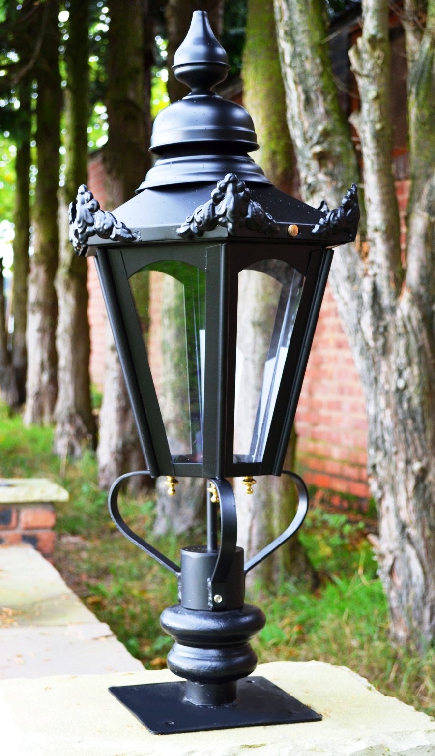 Black hexagonal light on entrance wall