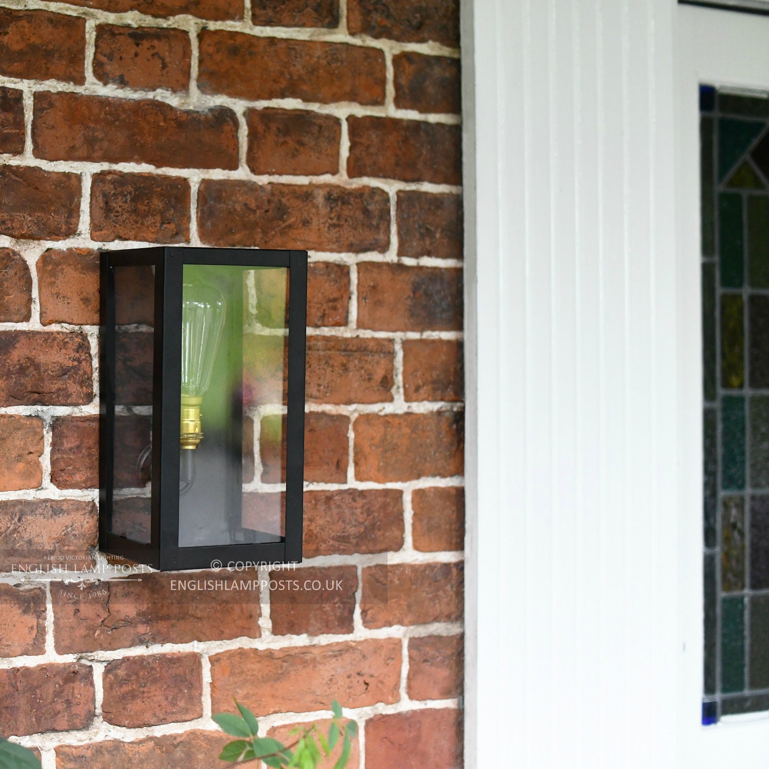 Black Modern Wall Lantern Installed In Front Porch Entrance