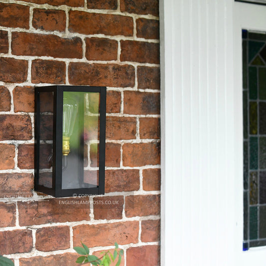 Black Modern Wall Lantern Installed In Front Porch Entrance