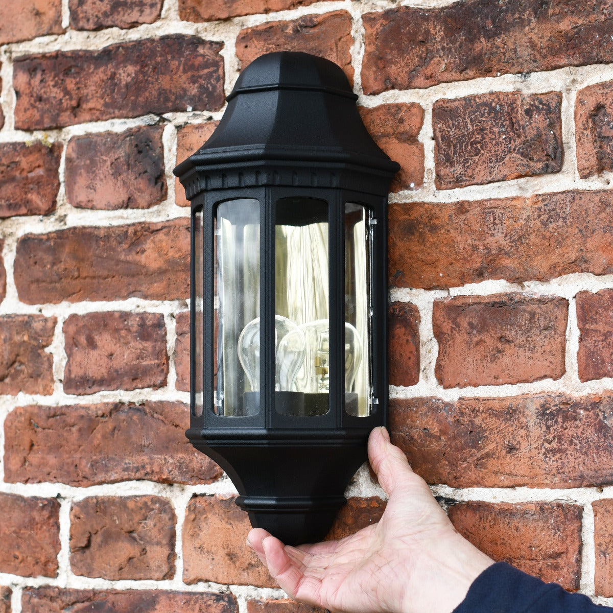 Black Traditional Flush Half Wall Lantern With Hand For Scale