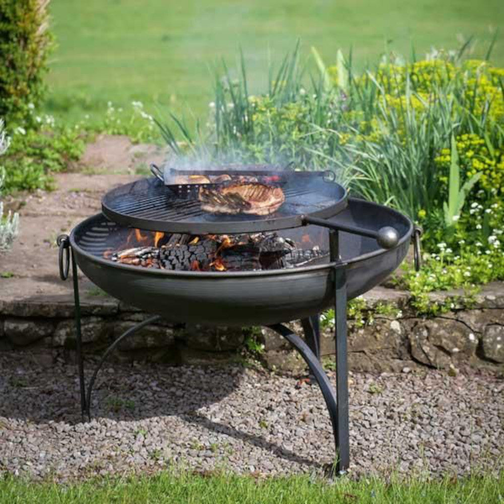 The barbecue in action with its swing arm grill 