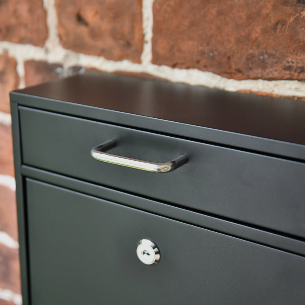 Silver handle on matte-black mail box