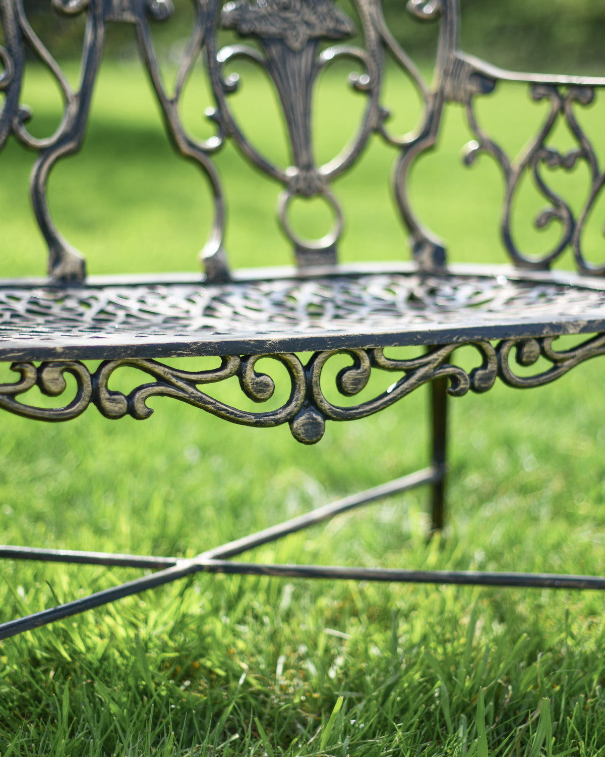 Outdoor bench with ornate edges 