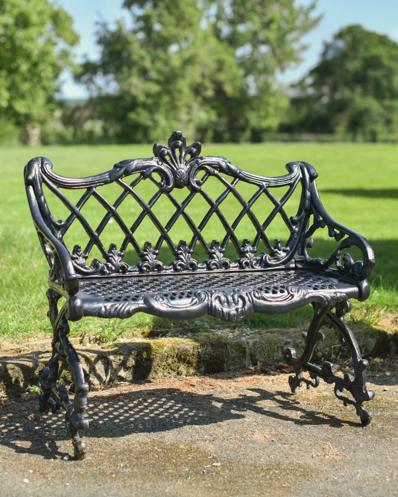 Angled view of the black 'Camden' bench in situ