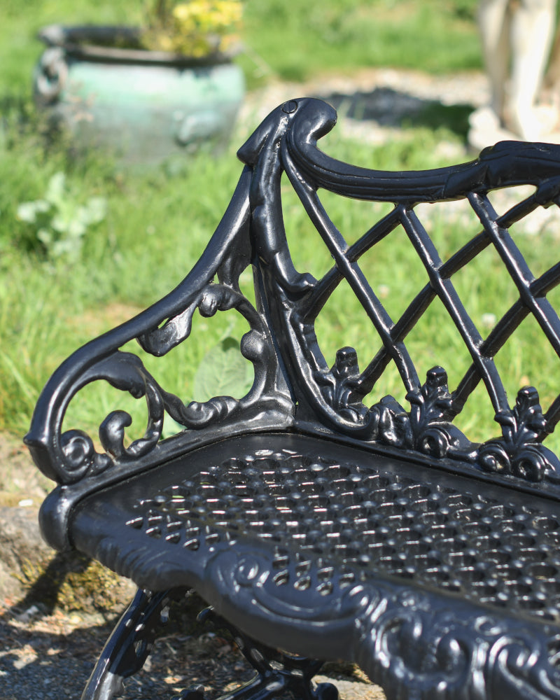 Angled view of the scrolled armrests