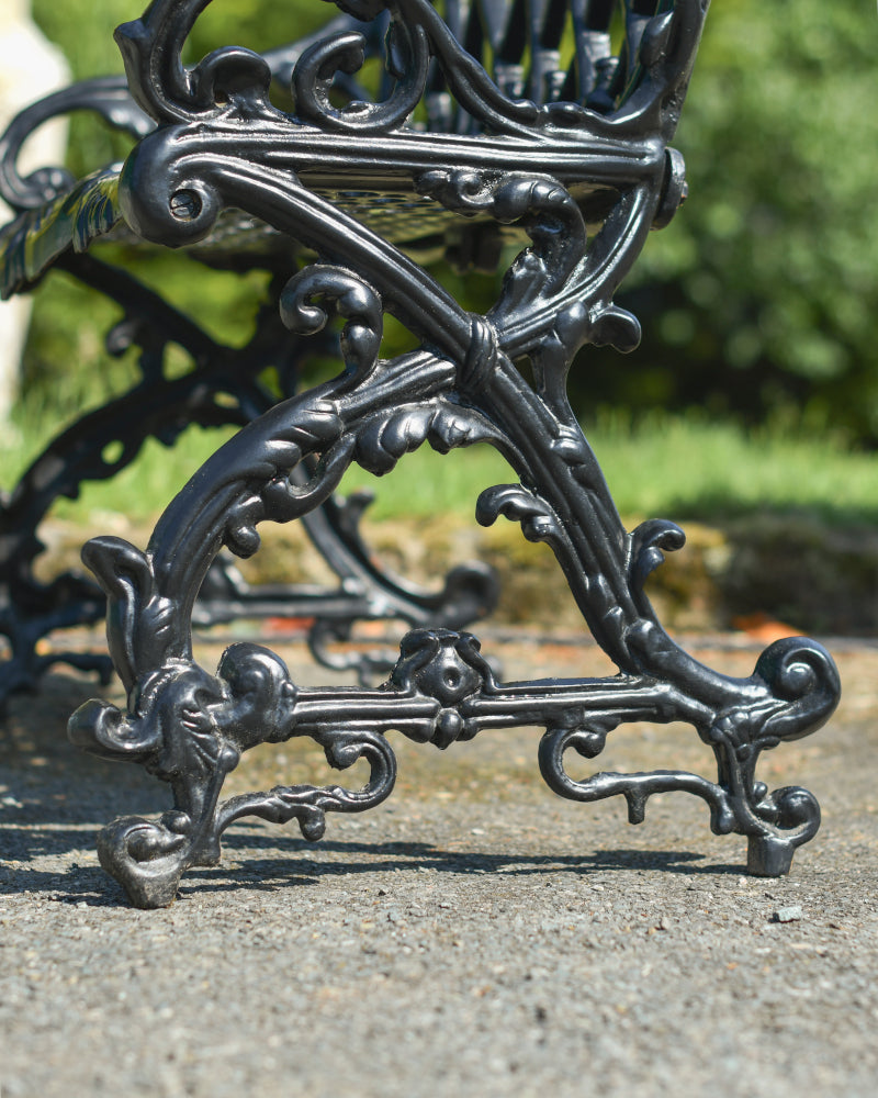 Magnified view of the ornate bench feet 