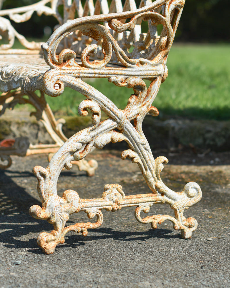 Close up of the scrolled bench feet