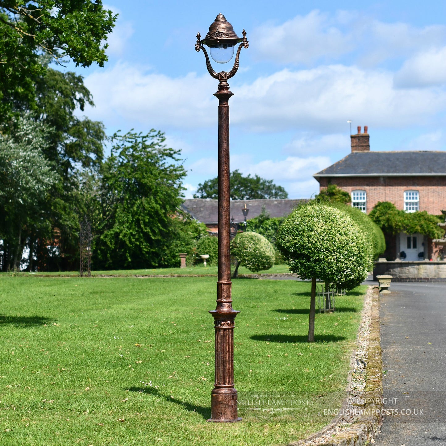 Cast Iron Lamp Post In Antique Copper Installed Along Driveway
