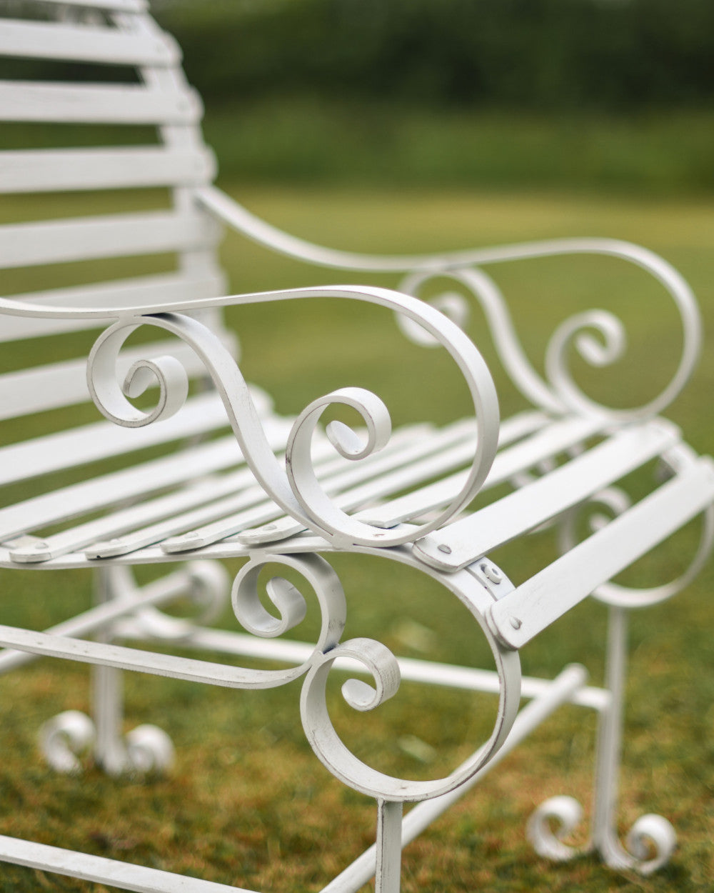 Coiled garden arm rests