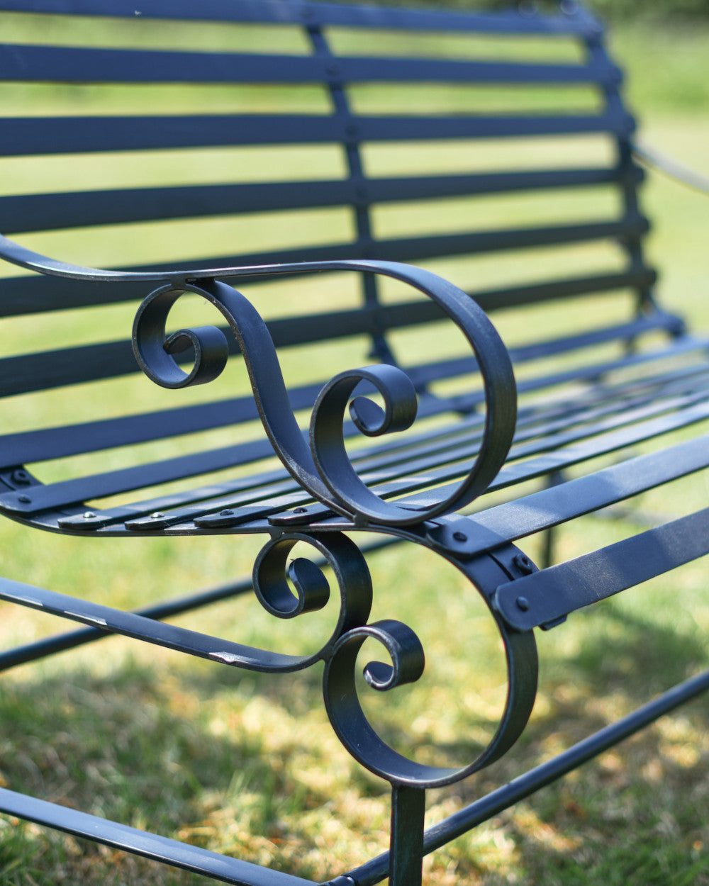 Coiled bench arm rests