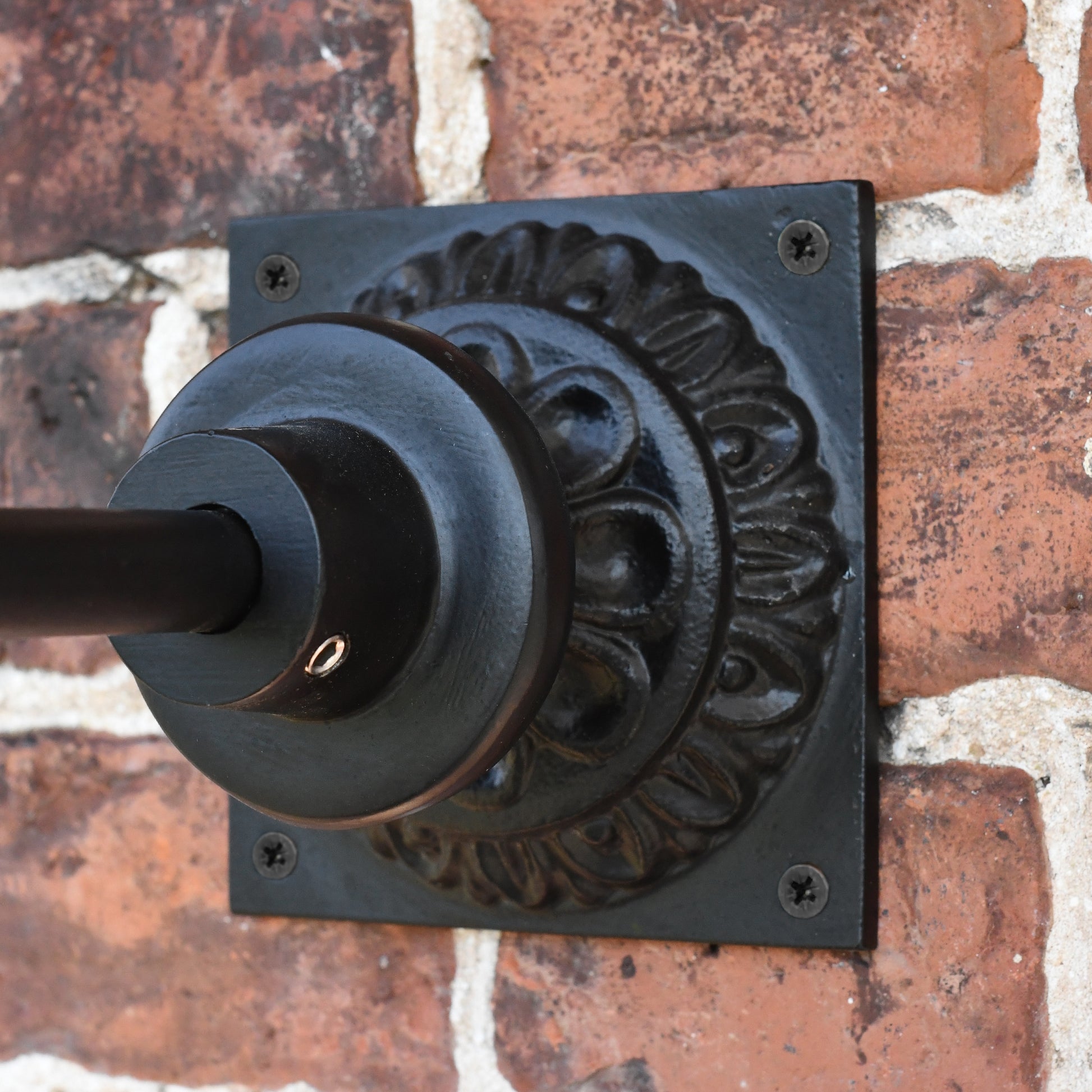 Close up of hanging bracket on square wall light