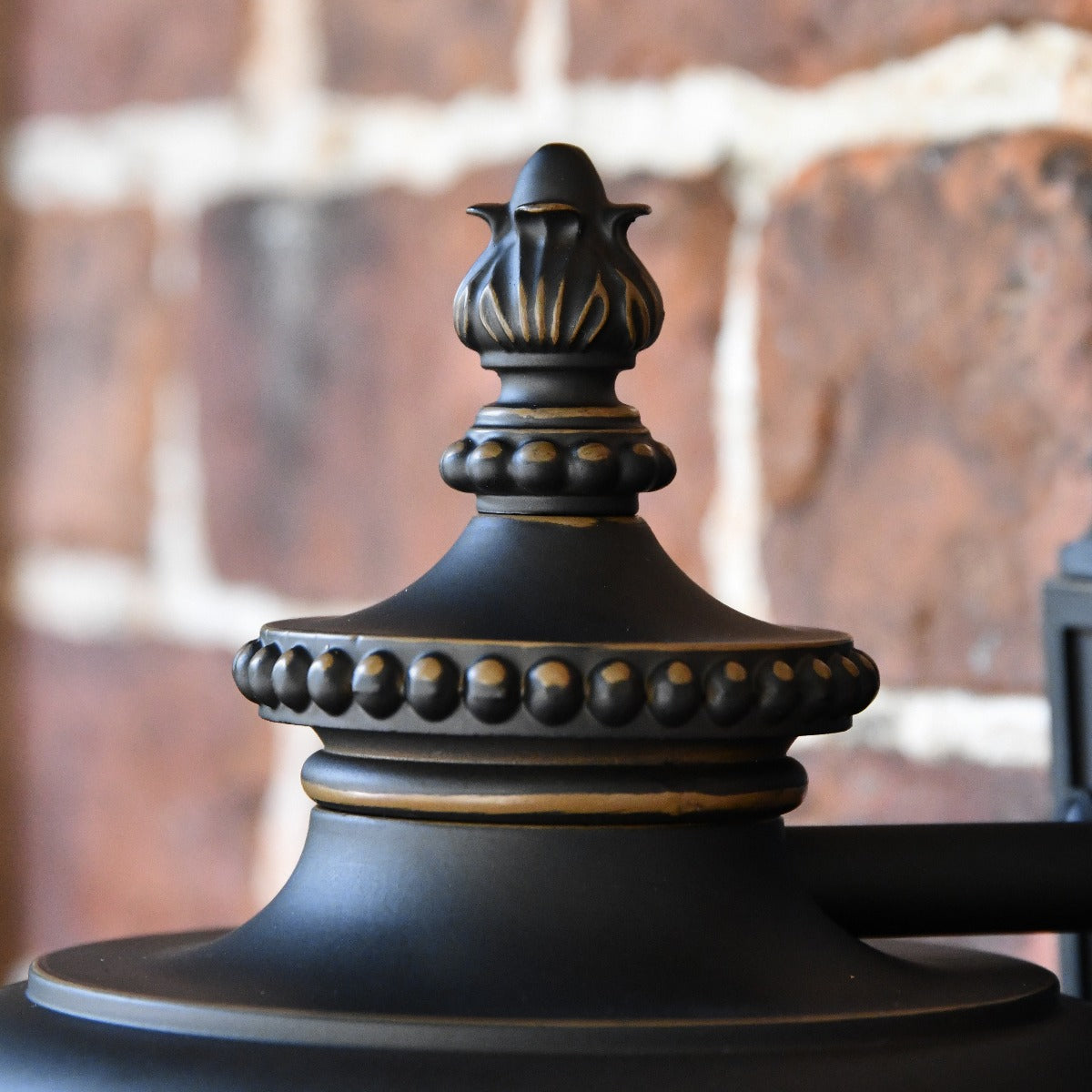 Close Up Of Lid Of Bronze Ribbed Glass Wall Lantern