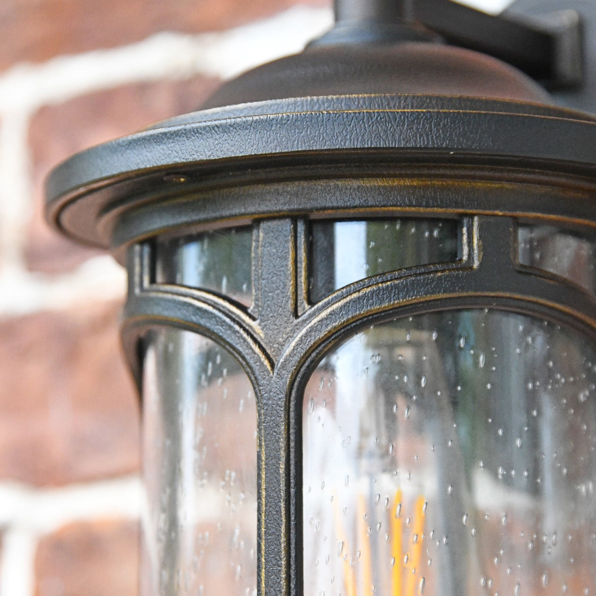 Close Up Of Seeded Glass Lense On Bronze Wall Light