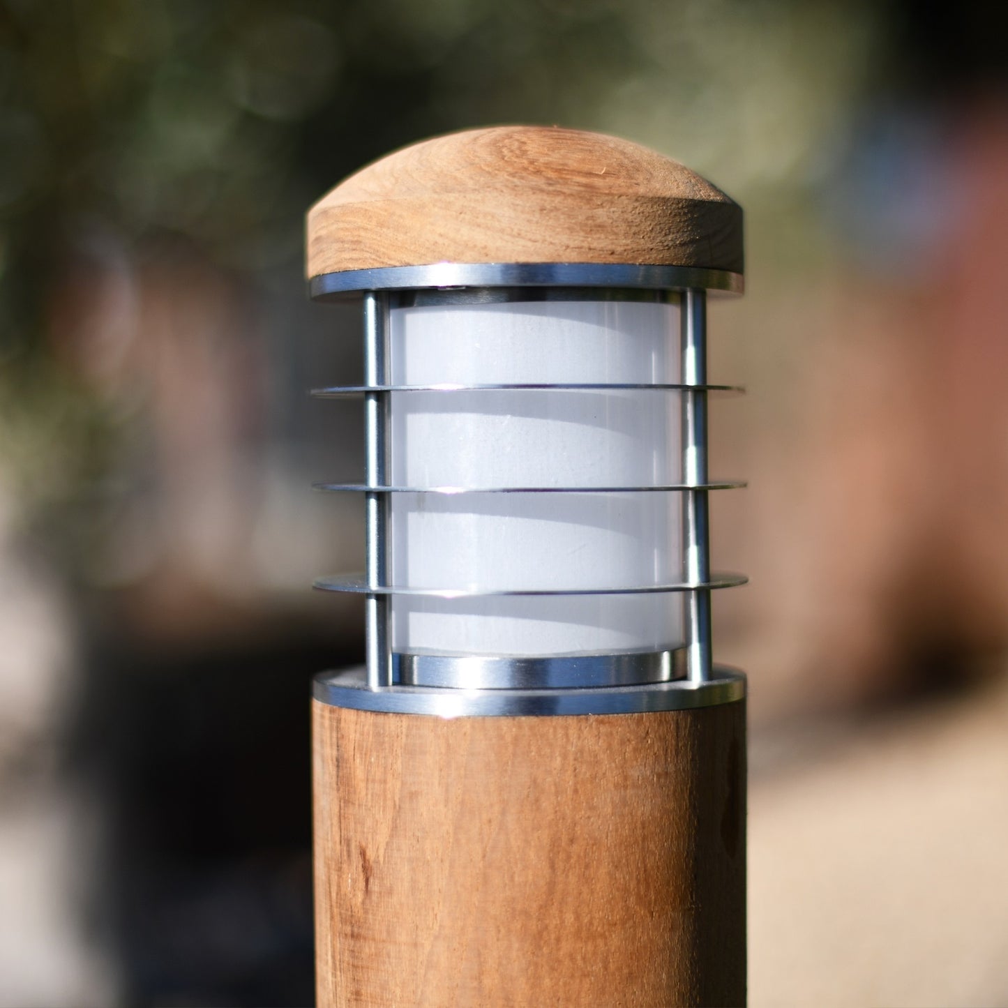 Close Up of Teak and Stainless Steel Driveway Bollard Light