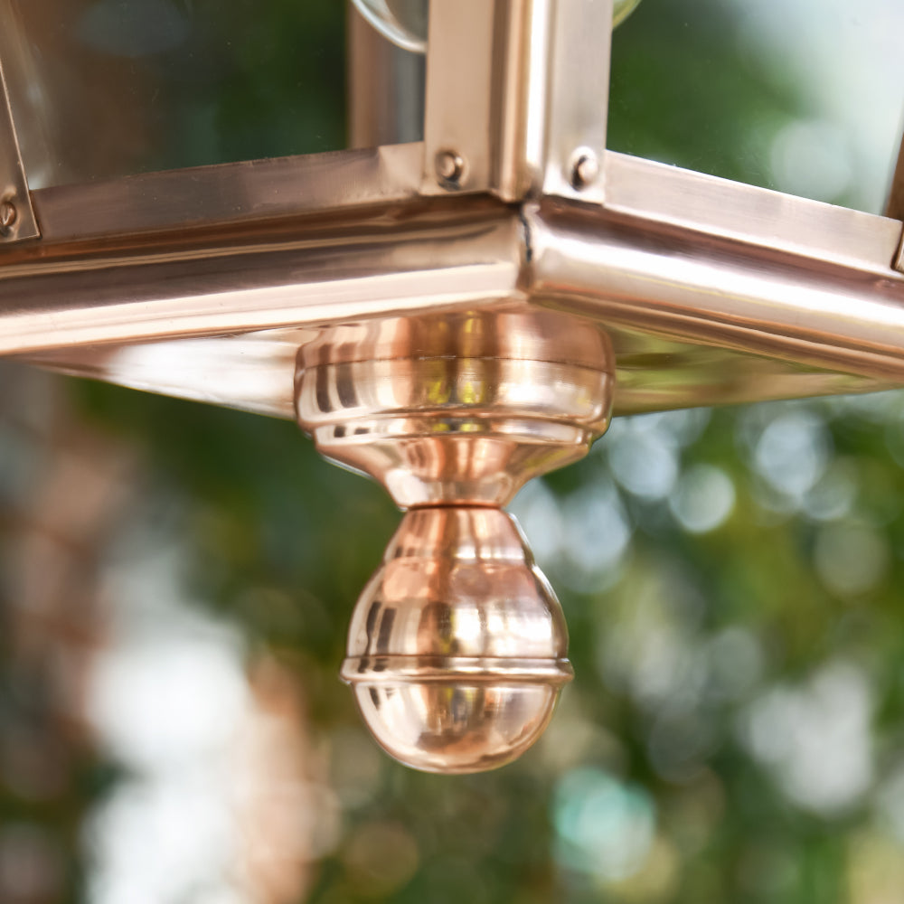 Ornate copper ball at the base of lantern