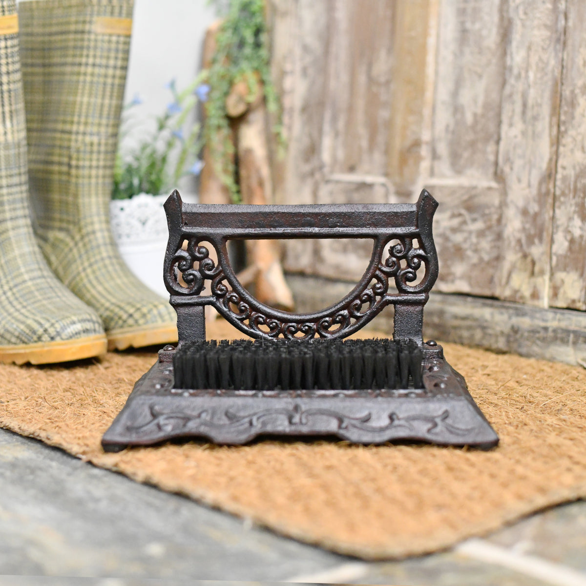View of the leaf motif boot brush and scraper