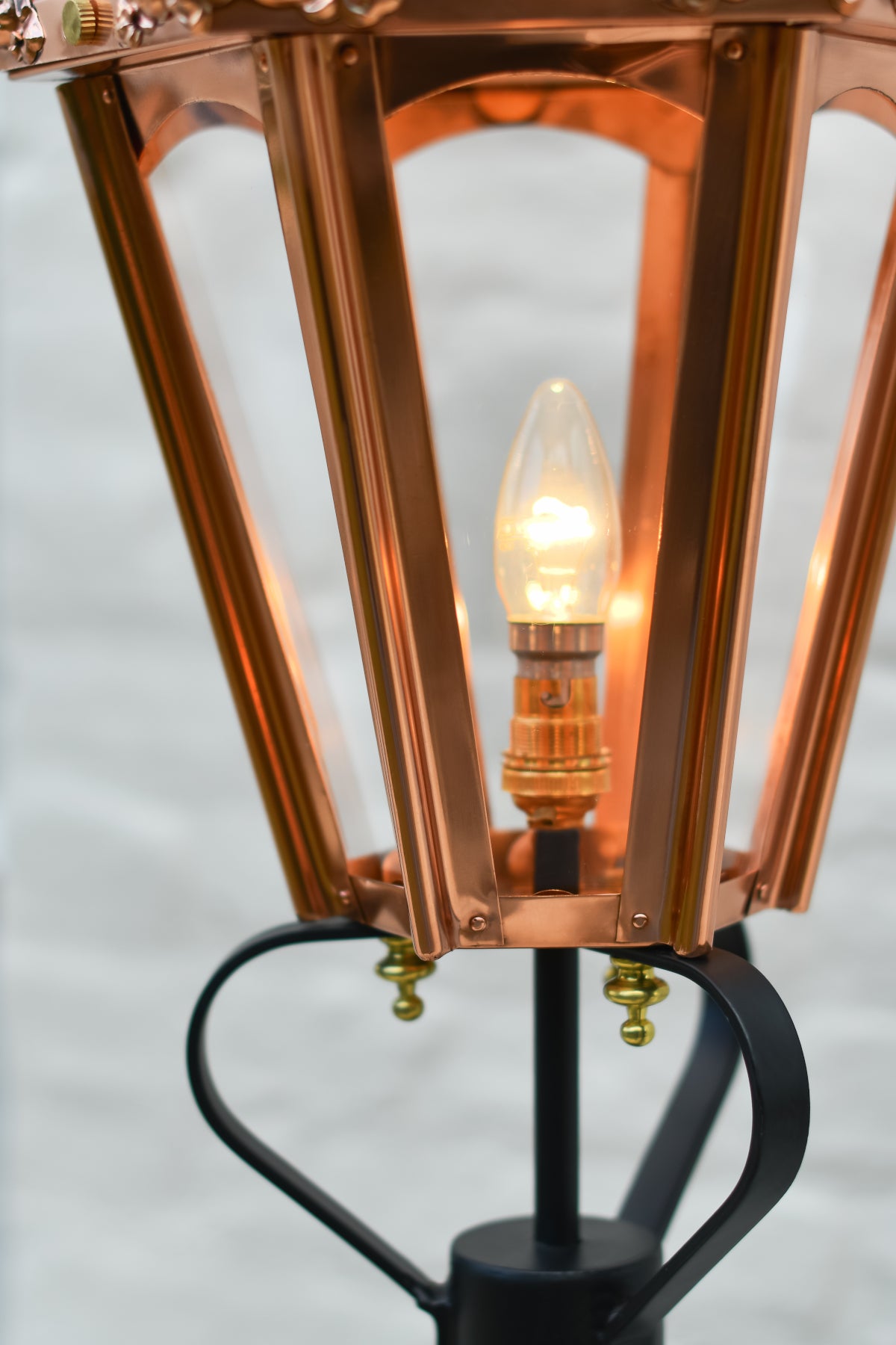 The clear panes of the copper lantern