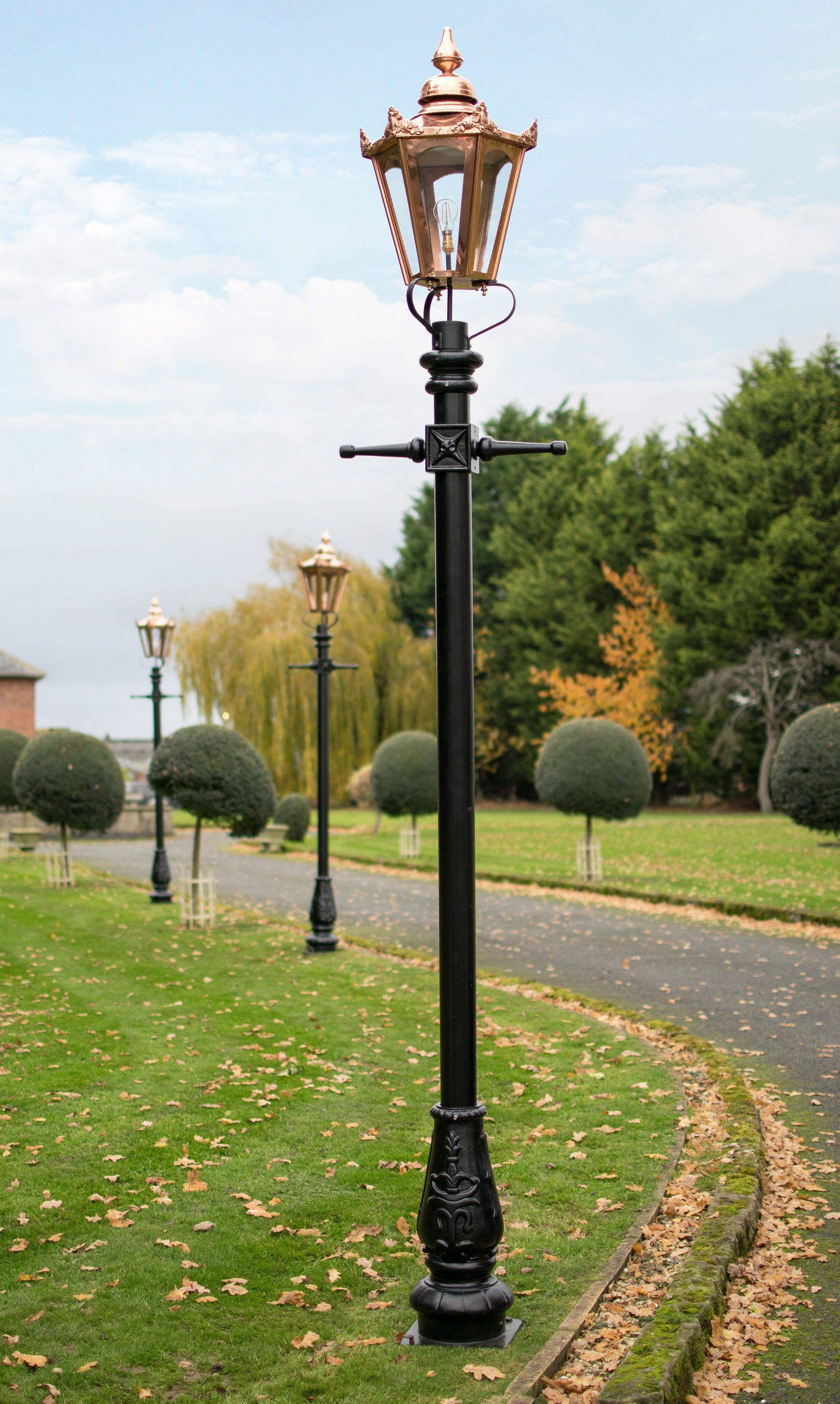 Copper Hexagonal Garden Lamp Post Lining Driveway
