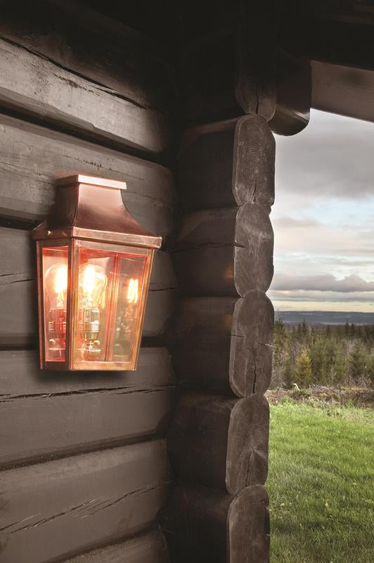 Copper Wall Lantern On Wooden Cabin