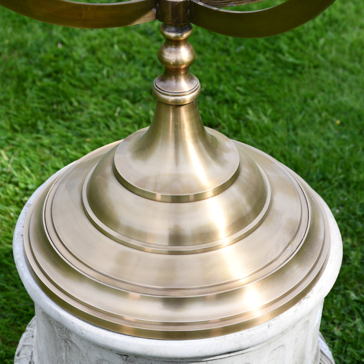 Close up of the brass tiered base